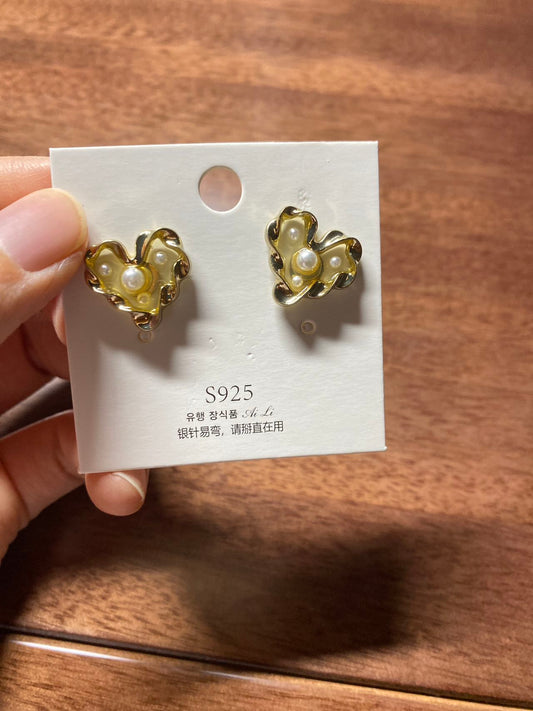 Gold heart-shaped earrings